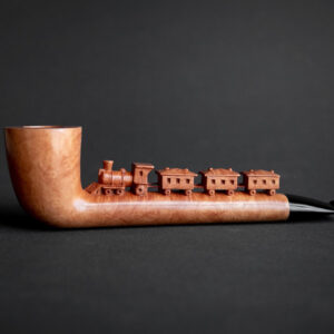 Locomotive pipe, a sculptural smoking pipe hand carved by Arcangelo Ambrosi, based on an illustration by Dino Buzzati