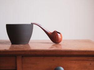 Drop pipe. Half-bent freehand apple in a till life photo.