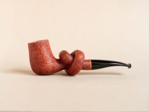 Knotted pipe made of sandblasted briar and ebonite.Handmade by Arcangelo Ambrosi