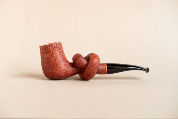 Knotted pipe made of sandblasted briar and ebonite.Handmade by Arcangelo Ambrosi