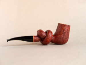 Knotted pipe made of sandblasted briar and ebonite.Handmade by Arcangelo Ambrosi