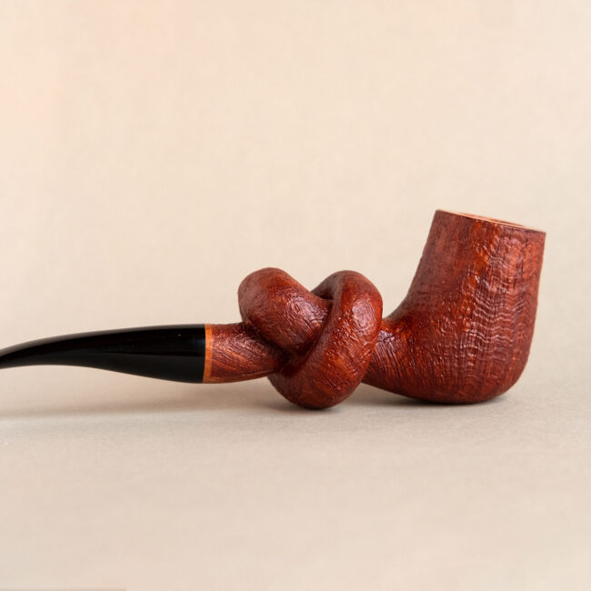 Knotted pipe made of sandblasted briar and ebonite.Handmade by Arcangelo Ambrosi