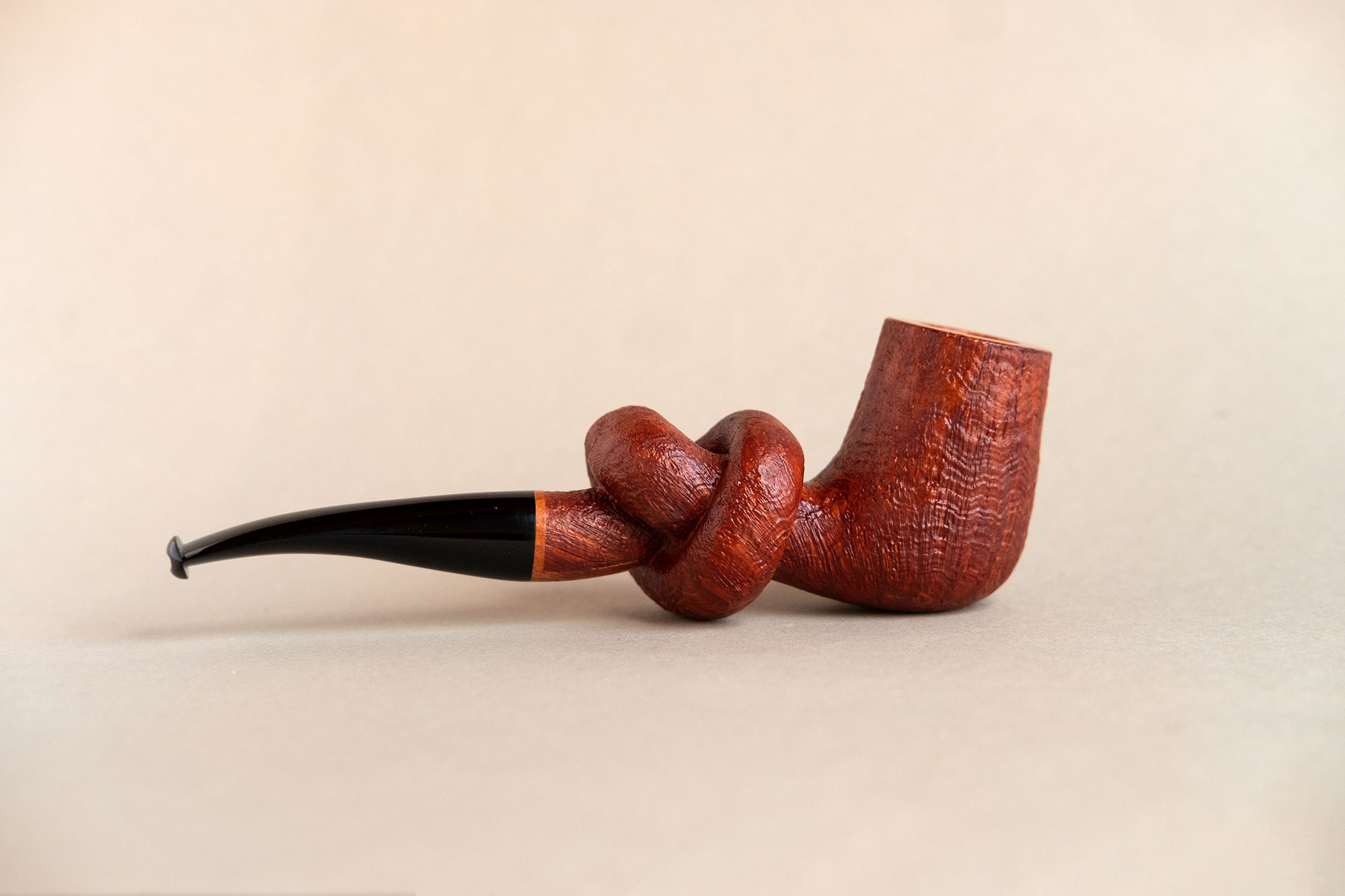 Knotted pipe made of sandblasted briar and ebonite.Handmade by Arcangelo Ambrosi